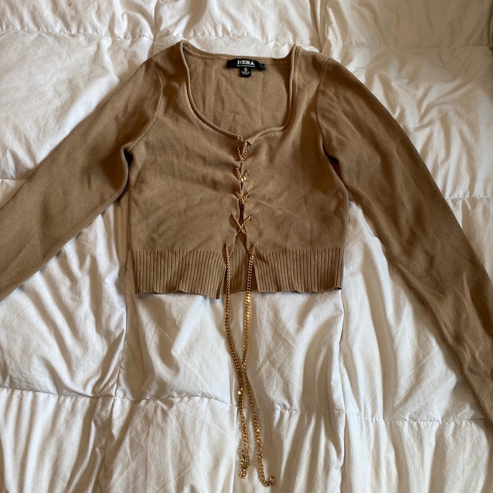 worn once, brown long sleeve, chain crisscross down the middle,very flattering,